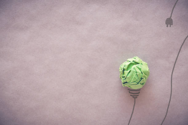 istock unplugged green paper light bulb, eco energy saving concept 908478162