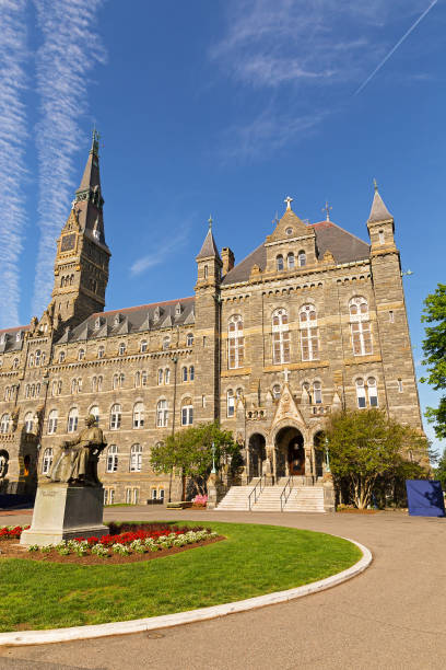 istock Georgetown University main square with the statue of its founder and Healy Hall on background. 908480940