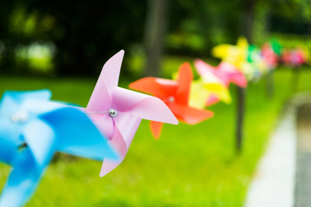 istock Origami wind turbines hunging in a row 908487310