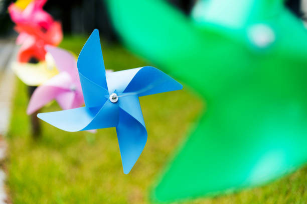 Origami wind turbines hunging in a row