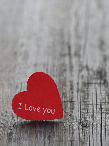 istock Red heart on wood background 908502686