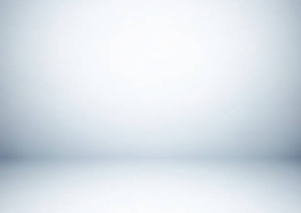 Empty gray studio room, used as background for display your products Empty gray studio room, used as background for display your products spot lit photos stock illustrations