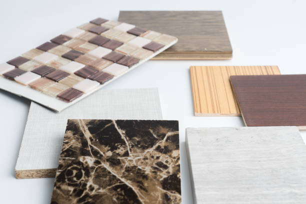 istock samples of material, wood , color ,ceramic on wooden table on white background .Interior design select material for idea. 908511556