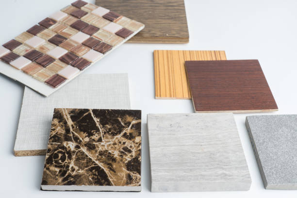istock samples of material, wood , color ,ceramic on wooden table on white background .Interior design select material for idea. 908511578