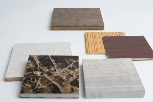 istock samples of material, wood , color ,ceramic on wooden table on white background .Interior design select material for idea. 908511588