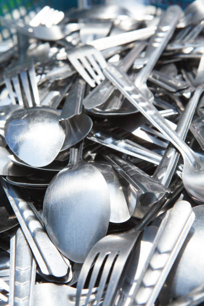 istock stack pile of spoons and forks dry of sunlight 908511612