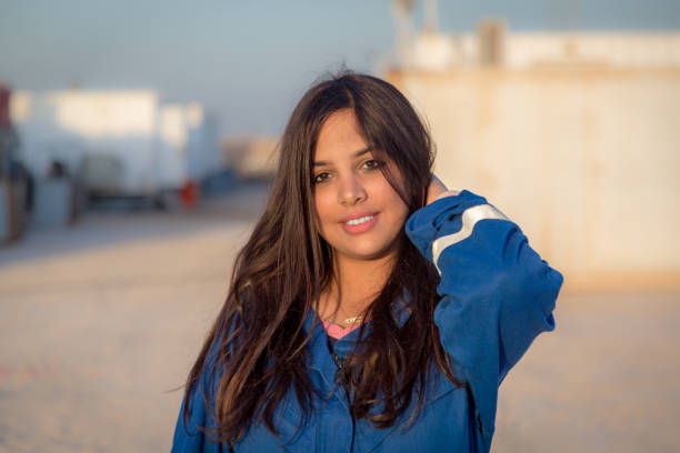 Young and beautiful. Positive cheerful happy woman smiling and looking at you while showing her emotions