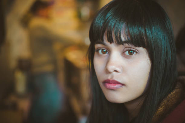 istock Serene young woman looking at camera. 908512164