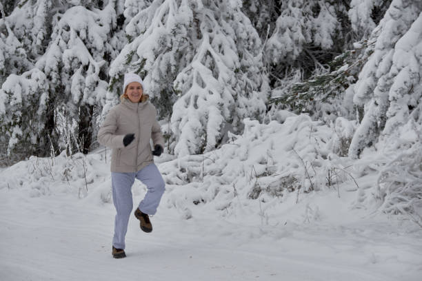 istock happily running through the woods 908515052