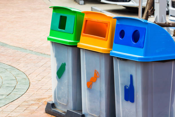 istock Different Color bins for collection of recycle junk 908515400