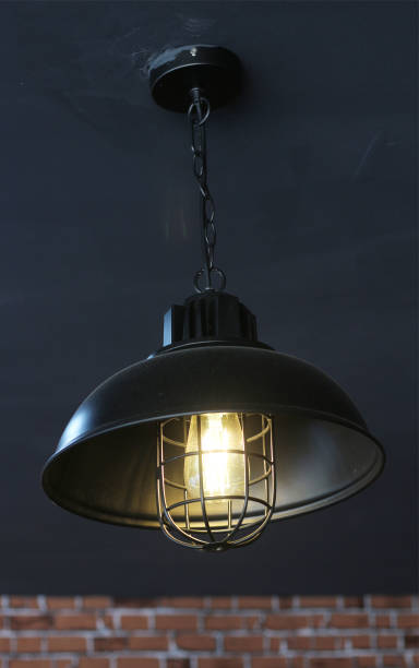istock vintage lamp light in cafe background. 908515538