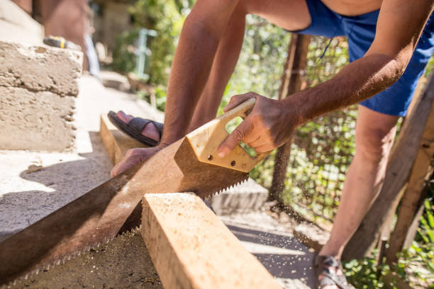 istock A man is sawing a beam of wood 908515814