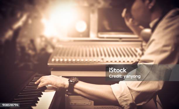 Male Dj Musician Playing Midi Keyboard Synthesizer In Nightclub Concert Focus On Hands Stock Photo - Download Image Now