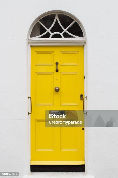 Yellow Elegant Residential Apartment Door Stock Photo - Download Image Now - Door, Yellow, Brick