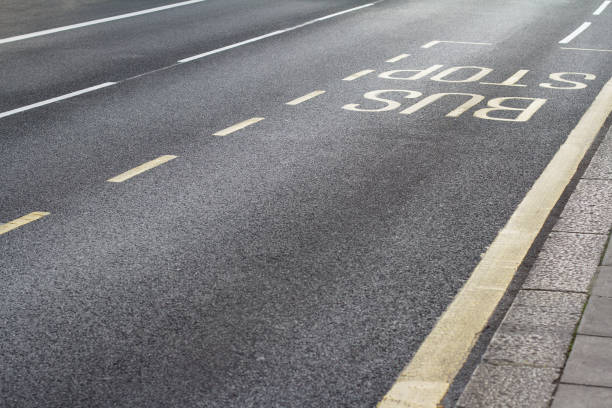 istock bus stop station near sidewalk 908521632