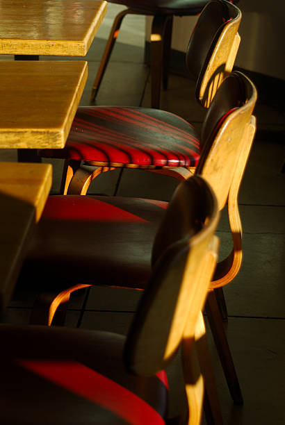 istock sun illuminated red wooden cafe chairs 90852686