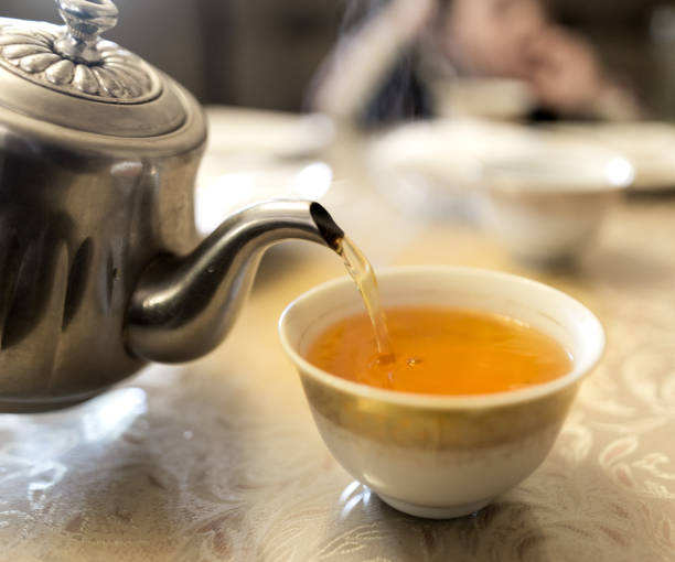 istock Hot tea in a pial in a cafe 908528204