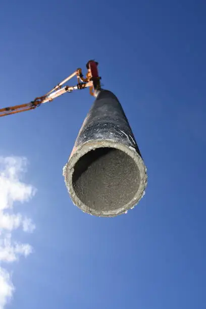 Photo of Concrete pump at construction site, unique point of view