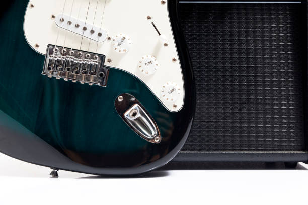 istock Guitar sitting next to a black amp 908531158