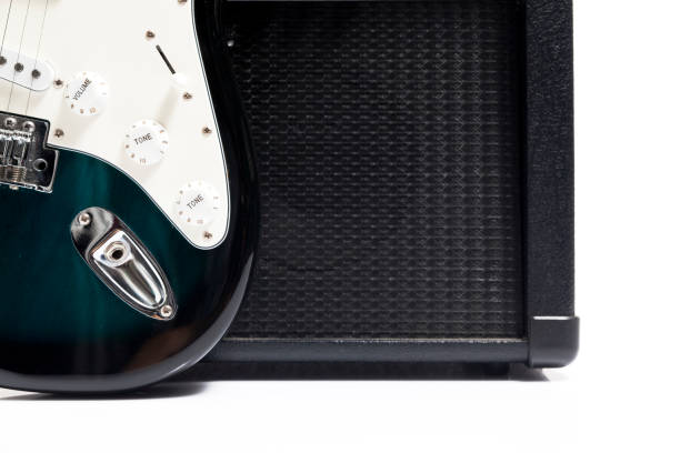 istock Guitar sitting next to a black amp 908531164