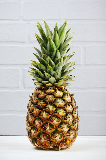 istock Fresh ripe whole pineapple for healthy nutrition 908535376