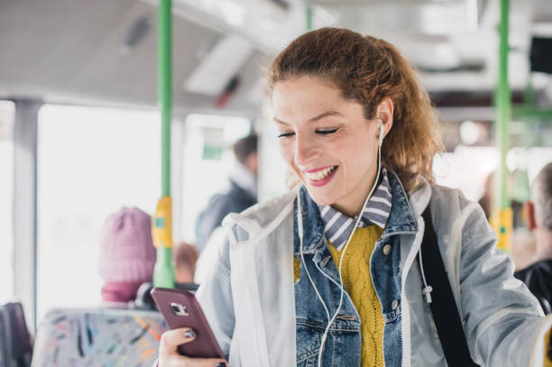 istock Young Woman Taking Public Transportation 908537756