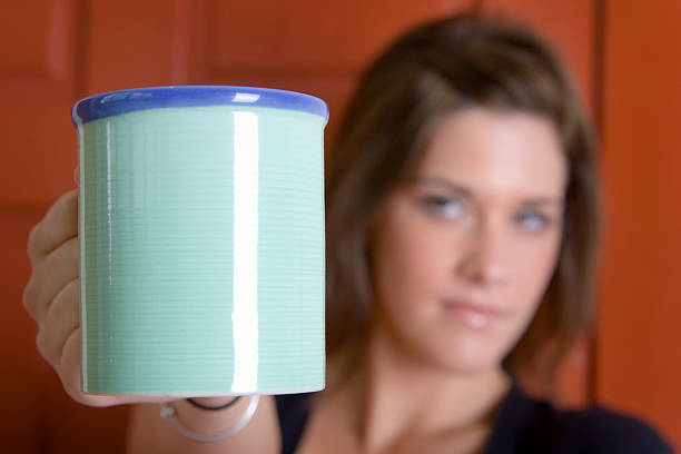 istock Woman holding out a coffee mug 90853968