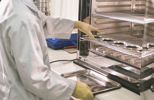 istock Young laboratory assistant prepare instrument for chemical lab experiment in Lab 908540070