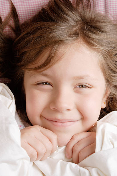 istock small blond girl looking at camera 90854139