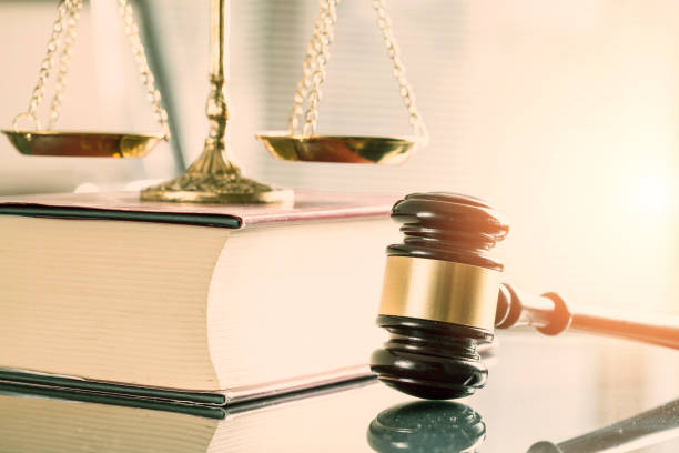 istock Justice book, bronze scale and judge mallet 908543242