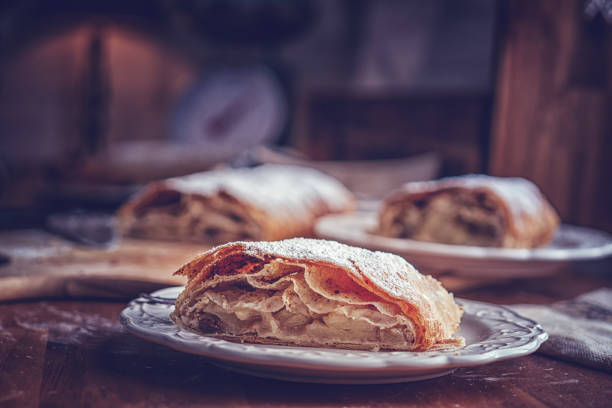 Homemade Apfelstrudel with Powdered Sugar Homemade Apfelstrudel with Powdered Sugar apple strudel stock pictures, royalty-free photos & images