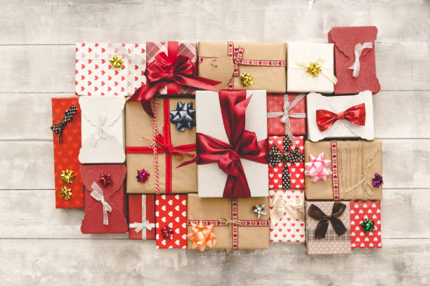 istock Flat Lay with Gift boxes, Ribbons, Decorations in red colors. Flat lay, top view 908545554
