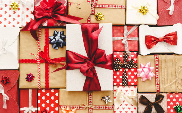 istock Flat Lay with Gift boxes, Ribbons, Decorations in red colors. Flat lay, top view 908545778