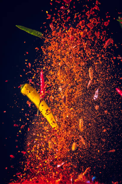 istock Spice Mix Food Explosion with Chili Peppers and Basil 908545966