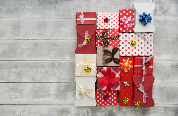 istock Flat Lay with Gift boxes, Ribbons, Decorations in red colors. Flat lay, top view 908546048