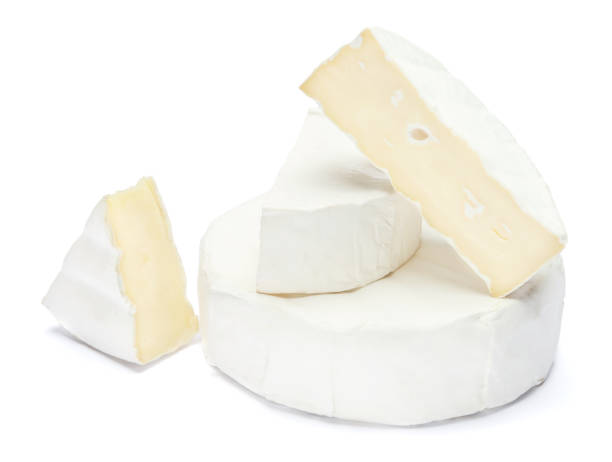 istock Pile of brie or camambert cheese on a white background 908546252