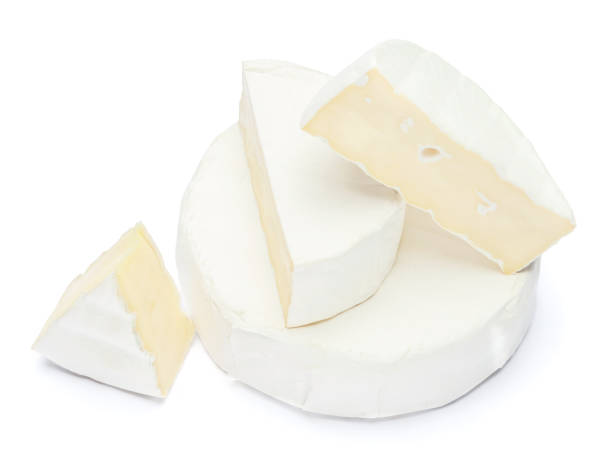 istock Pile of brie or camambert cheese on a white background 908546262