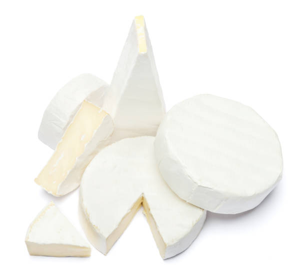 istock Pile of brie or camambert cheese on a white background 908546300