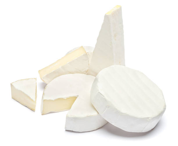 istock Pile of brie or camambert cheese on a white background 908546324