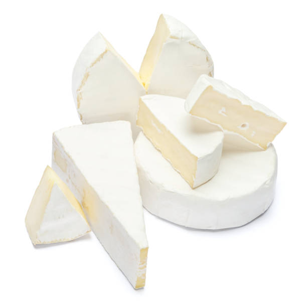 istock Pile of brie or camambert cheese on a white background 908546360