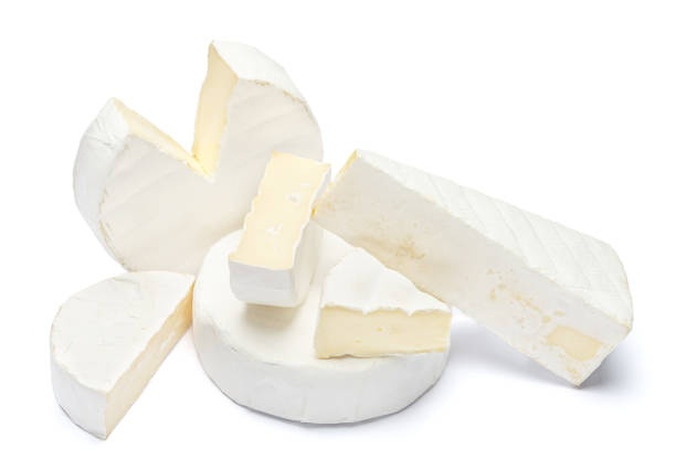 istock Pile of brie or camambert cheese on a white background 908546396