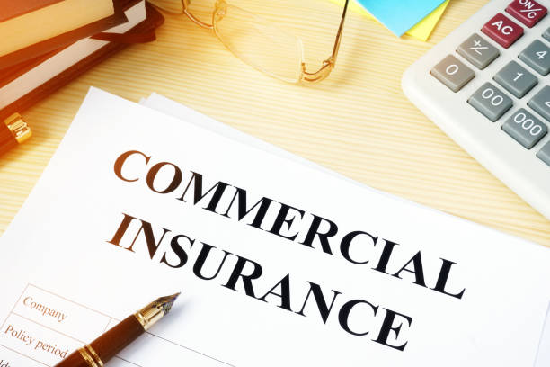 istock Commercial insurance policy on an office desk. 908546790