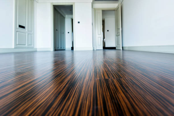 istock White empty room with wooden floor and door 908546982