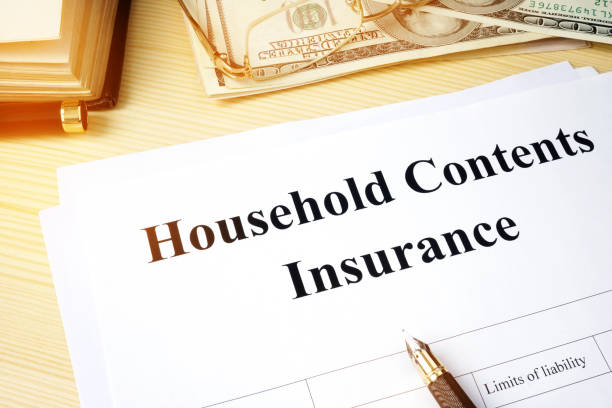 istock Household contents insurance policy on a desk. 908547180