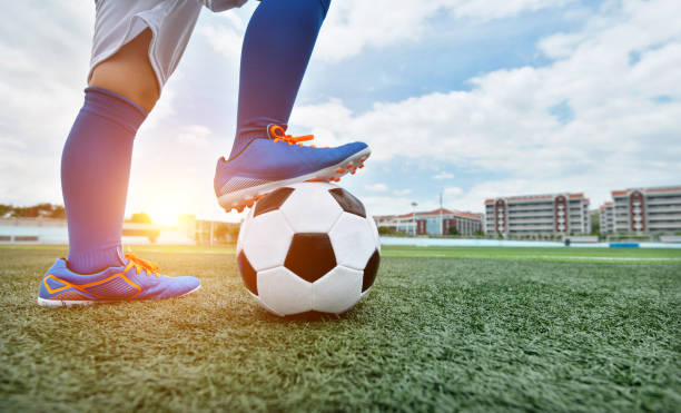 istock Football player feet waiting for kick off 908553184