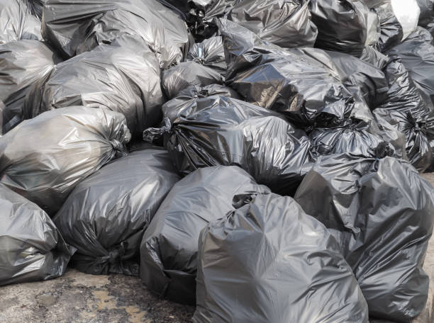 istock Pile of black garbage bags with trash 908556684