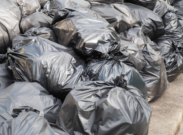 istock Pile of black garbage bags with trash 908556688