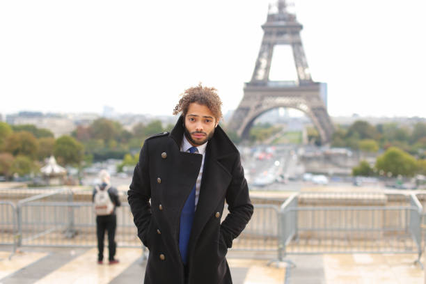 istock male model smiling near Eiffel Tower 908556976