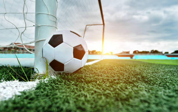 Soccer ball is outside the goal