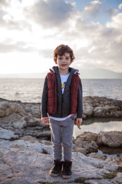istock Portrait of a laughing little boy 908564186